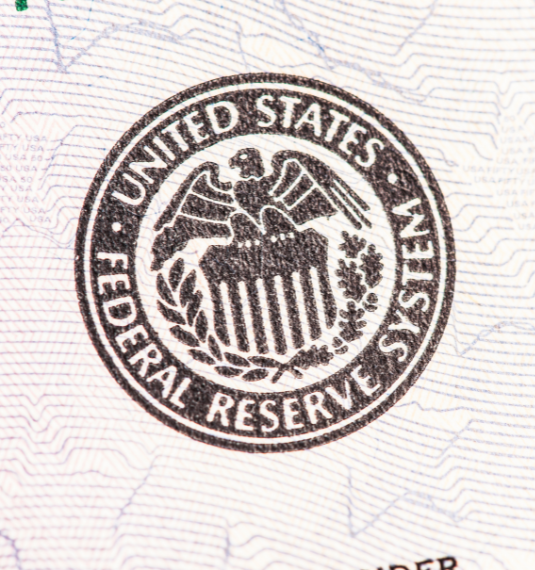 A seal for the US Federal Reserve to represent rate cuts in the latest investment outlook | Generate