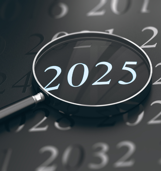 A magnifying glass enlarging the numbers 2025 on a black background to represent Generate's success in performance, service and partnerships n 2025