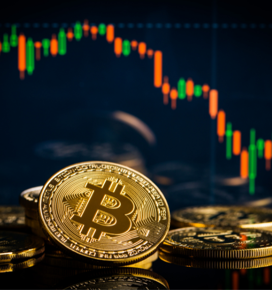 A pile of bitcoins with a downward-trending red and green graph in the background to represent bitcoin's fall, the rise of gold and other market movements | Generate