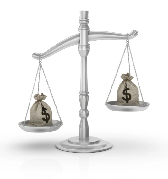 A scale balancing two bags of money
