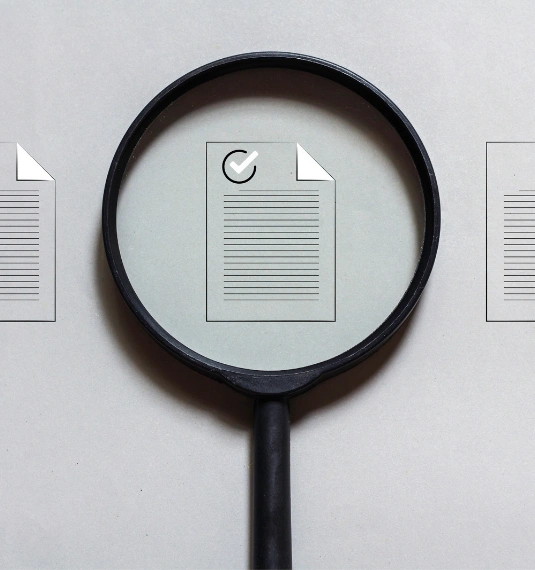 A magnifying glass over a document to represent the latest updates to Generate KiwiSaver Scheme and Managed Funds documents, including investment mix changes, updated risk indicators and lower Managed Fund charges.
