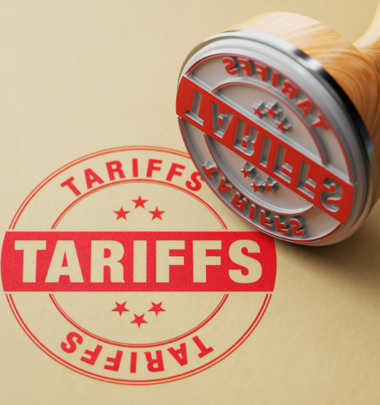 A red ink stamp saying tariffs on a cream background.