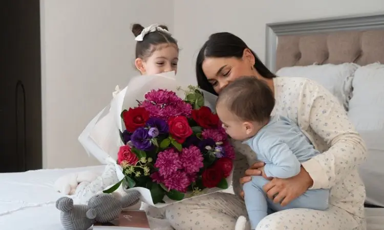 mum showing flowers to kids